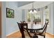 Inviting dining area with bay windows and a chandelier at 2321 Mica Mine Ln, Wake Forest, NC 27587