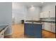 Open kitchen area with island cooktop and eat-in counter at 2321 Mica Mine Ln, Wake Forest, NC 27587