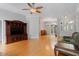 Spacious living room featuring hardwood floors, abundant natural light, a tv cabinet, and inviting atmosphere at 2321 Mica Mine Ln, Wake Forest, NC 27587