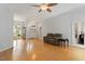 Bright living room with hardwood floors, neutral walls, and ceiling fan at 2321 Mica Mine Ln, Wake Forest, NC 27587
