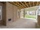 Outdoor patio with brick columns, a covered ceiling and view of the lawn at 2321 Mica Mine Ln, Wake Forest, NC 27587