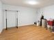 Spacious utility room with wood flooring and storage at 2321 Mica Mine Ln, Wake Forest, NC 27587
