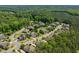 An aerial view of the neighborhood filled with lush greenery and mature trees at 2421 Trenton Park Ln, Raleigh, NC 27607