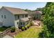 A spacious backyard featuring a stone patio and inviting sunroom at 2421 Trenton Park Ln, Raleigh, NC 27607