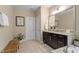 Bathroom featuring a vanity with double sinks, a soaking tub, and tile floors at 2421 Trenton Park Ln, Raleigh, NC 27607
