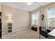 Calming bedroom featuring a ceiling fan and neutral tones, with natural light for a relaxing retreat at 2421 Trenton Park Ln, Raleigh, NC 27607