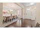Dining room features hardwood floors, chandelier, rug, and view to the front door at 2421 Trenton Park Ln, Raleigh, NC 27607