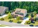 Traditional two-story home with well-manicured lawn, beautiful landscaping, and charming curb appeal at 2421 Trenton Park Ln, Raleigh, NC 27607