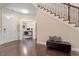 Foyer with hardwood floors, staircase, and an office view at 2421 Trenton Park Ln, Raleigh, NC 27607
