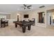 Entertaining game room with a pool table, TV, and comfortable seating, great for Gathering and friends gatherings at 2421 Trenton Park Ln, Raleigh, NC 27607