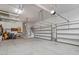 Spacious garage with high ceilings, ample storage, and an automatic door, ideal for multiple vehicles and projects at 2421 Trenton Park Ln, Raleigh, NC 27607