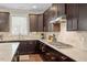 Gourmet kitchen featuring granite countertops, stainless steel appliances, and ample cabinet space at 2421 Trenton Park Ln, Raleigh, NC 27607