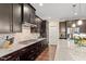Modern kitchen featuring stainless appliances, granite countertops, and gas cooktop with vent at 2421 Trenton Park Ln, Raleigh, NC 27607