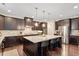 Spacious kitchen features granite countertops, stainless steel appliances, and a large center island with seating at 2421 Trenton Park Ln, Raleigh, NC 27607