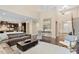 Bright living room features high ceilings, hardwood floors, and contemporary furniture at 2421 Trenton Park Ln, Raleigh, NC 27607