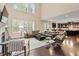 Open-concept living room featuring dark hardwood floors, two-story ceilings and a window view at 2421 Trenton Park Ln, Raleigh, NC 27607