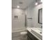 Modern bathroom featuring a soaking tub with tile surround, and a stylish vanity with vessel sink at 245 Marilyn Cir, Cary, NC 27513