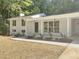 Traditional home boasting a well-manicured lawn with decorative plantings that lead to a covered front porch at 245 Marilyn Cir, Cary, NC 27513