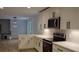 A kitchen featuring stainless steel appliances, white cabinets, light countertops, and modern subway tile backsplash at 245 Marilyn Cir, Cary, NC 27513