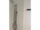Modern shower with hexagonal tile surround and stainless steel shower panel at 245 Marilyn Cir, Cary, NC 27513