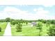 Scenic aerial view showcases a charming single-Gathering home with a lush lawn and a long driveway at 2540 Levi Ln, Bahama, NC 27503