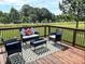 Cozy outdoor deck featuring modern furniture and a relaxing view of the yard at 2540 Levi Ln, Bahama, NC 27503