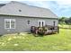 Home featuring a back deck and a spacious green yard at 2540 Levi Ln, Bahama, NC 27503