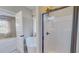 Bright bathroom boasting natural light, a soaking tub and glass-enclosed shower at 2540 Levi Ln, Bahama, NC 27503