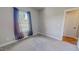 Cozy bedroom with neutral walls, carpet, a window, and sheer curtains allows for natural light at 2540 Levi Ln, Bahama, NC 27503
