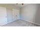 Cozy bedroom with plush carpet, fresh paint, and closet doors offers a clean, blank slate at 2540 Levi Ln, Bahama, NC 27503