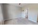 Neutral carpeted bedroom featuring neutral walls and a doorway that leads to a bathroom at 2540 Levi Ln, Bahama, NC 27503