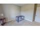 Neutral bedroom features carpeted floors, fresh paint, side table with lamp, and a desk for versatile use at 2540 Levi Ln, Bahama, NC 27503