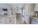 Dining area with stone countertops and island, luxury vinyl plank flooring and stainless steel appliances at 2540 Levi Ln, Bahama, NC 27503