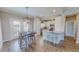 Eat-in kitchen featuring stainless appliances, granite counters, an island, and an adjacent dining area at 2540 Levi Ln, Bahama, NC 27503