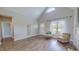 Comfortable living room features vaulted ceilings, light gray walls, and luxury vinyl plank flooring at 2540 Levi Ln, Bahama, NC 27503
