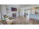 Bright living room boasts hardwood floors, a fireplace, built-in shelving, and an open floor plan at 2540 Levi Ln, Bahama, NC 27503