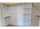 Organized walk-in closet with custom shelving and ample storage space at 2540 Levi Ln, Bahama, NC 27503