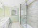 Bathroom featuring tiled glass shower, window and vanity with sink at 2920 Ode Turner Rd, Hillsborough, NC 27278