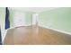 Hardwood floors in empty bedroom with freshly painted walls and trim at 2920 Ode Turner Rd, Hillsborough, NC 27278