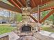 Close up of a brick pizza oven in the outdoor kitchen with stainless appliances and a covered wood pavilion at 2920 Ode Turner Rd, Hillsborough, NC 27278