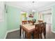View of dining room featuring wood table with seating for six, hardwood floors, and light-colored walls at 2920 Ode Turner Rd, Hillsborough, NC 27278