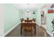 Dining room featuring wood table with seating for six, hardwood floors, and light-colored walls at 2920 Ode Turner Rd, Hillsborough, NC 27278