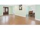 Dining room with hardwood floors, light-colored walls, a chandelier, and access to kitchen at 2920 Ode Turner Rd, Hillsborough, NC 27278