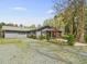 Charming home with a well-manicured lawn, attractive landscaping, and a convenient two-car garage at 2920 Ode Turner Rd, Hillsborough, NC 27278