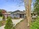 Inviting front entrance with a walkway, lovely landscaping, and a covered porch with a front door at 2920 Ode Turner Rd, Hillsborough, NC 27278