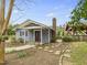 View of the home's front exterior featuring a cozy front porch and manicured landscaping at 2920 Ode Turner Rd, Hillsborough, NC 27278