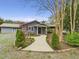 Charming single-story home featuring a landscaped front yard and inviting walkway to the front door at 2920 Ode Turner Rd, Hillsborough, NC 27278