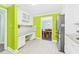 Spacious kitchen with white cabinets, countertops, and stainless refrigerator at 2920 Ode Turner Rd, Hillsborough, NC 27278