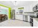 Bright kitchen features stainless appliances, white cabinets, and tile floors at 2920 Ode Turner Rd, Hillsborough, NC 27278