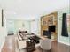 Cozy living room featuring a stone fireplace, neutral tones, and lots of natural light at 2920 Ode Turner Rd, Hillsborough, NC 27278
